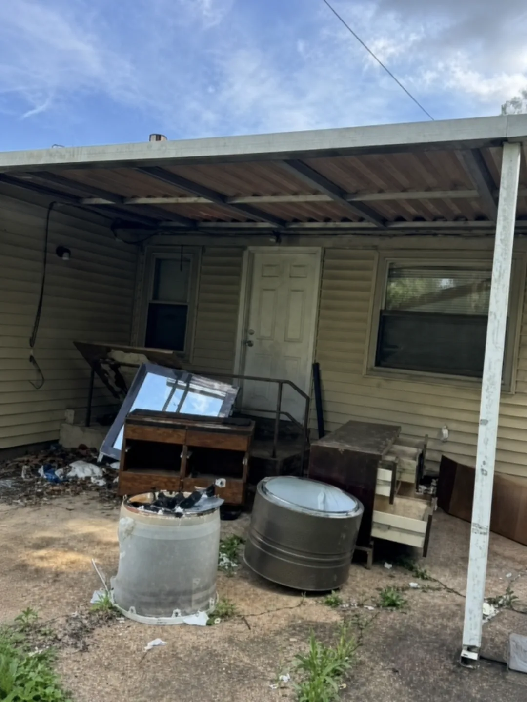 Covered porch before a One Foot Forward cleanout