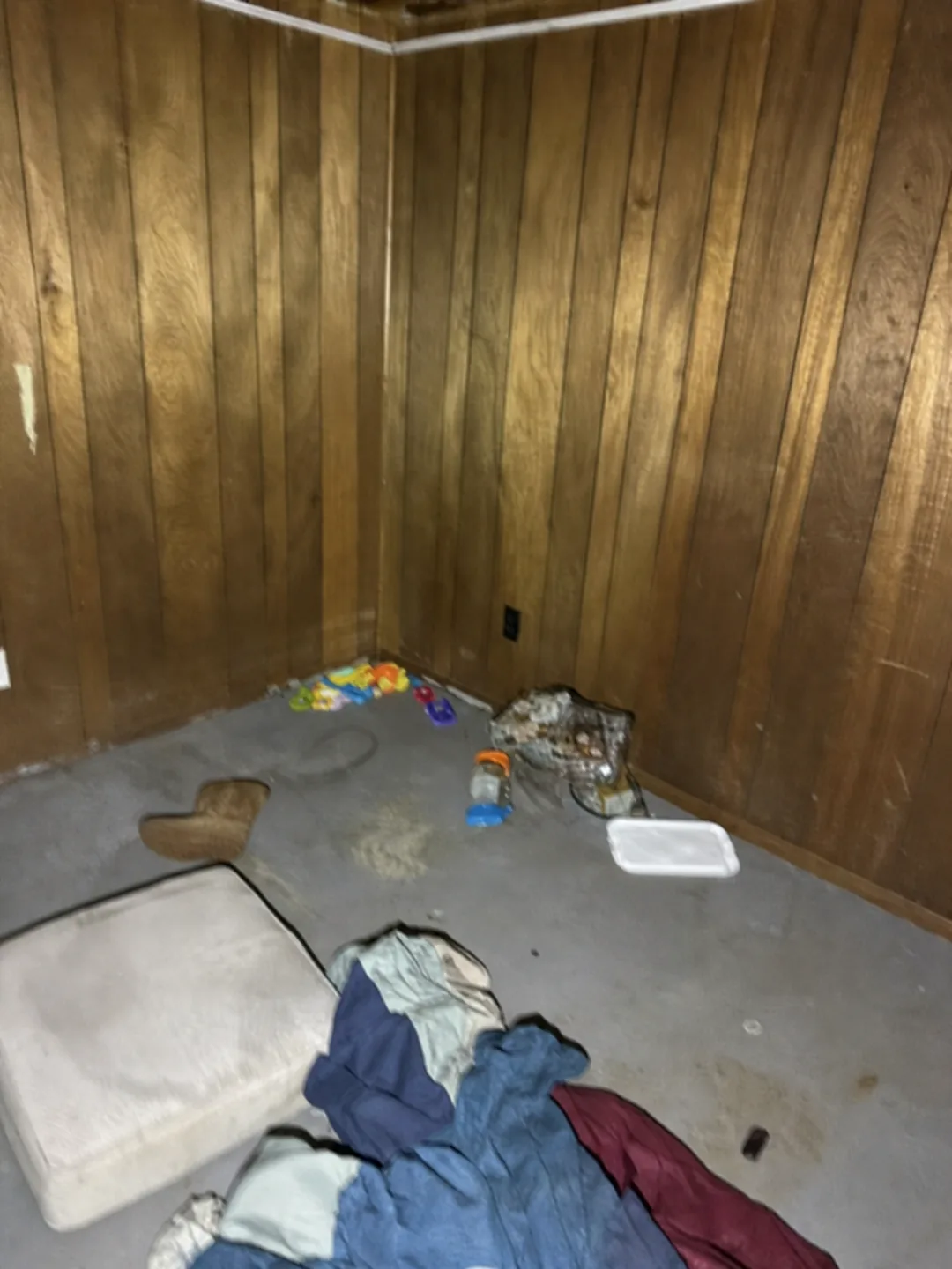 Wood-paneled room before a One Foot Forward property cleanout
